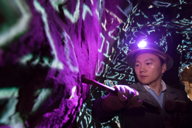 Environmental portraits of Jaewoo Lee "data mining" in a gold mine.