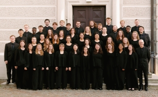 group photo of people, in black suits and gowns