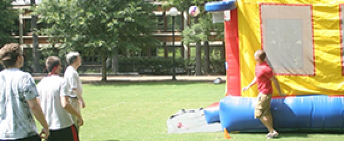 people with inflated bounce house