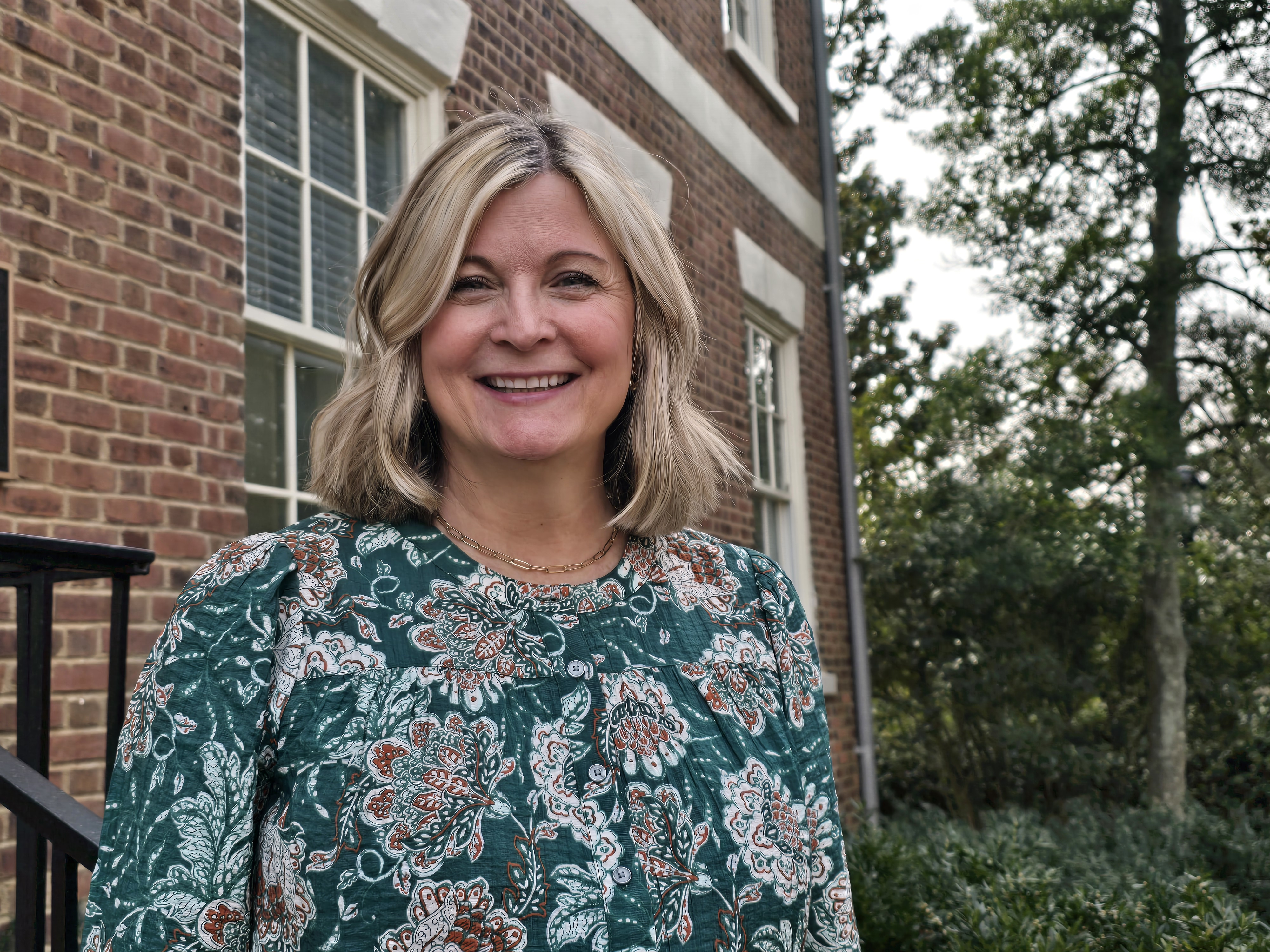 Kellie Borders Peyton outside of Old College