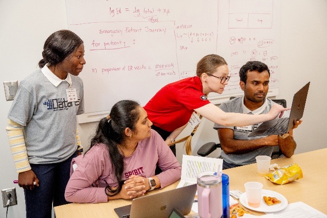 students looking at computer