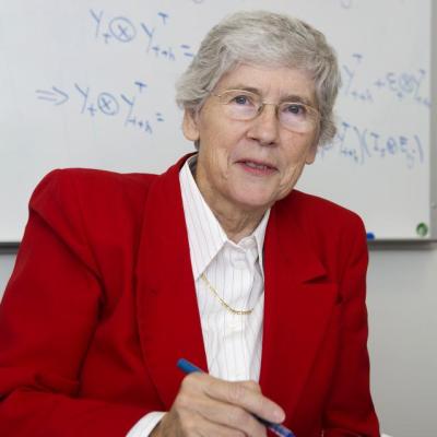 Lynne Billard in front of white board