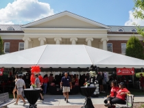 wide shot photo of event tent with people