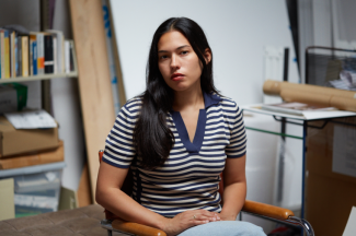 photo of woman seated in studio