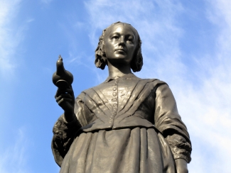 photo of statue with sky background