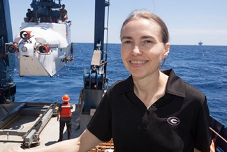 woman at sea on research vessel