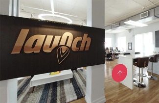 inside of an office space, with sign 'Launch'