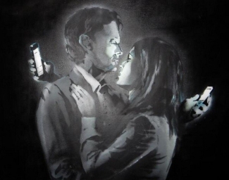 photo of graffiti drawing of couple looking at smartphones
