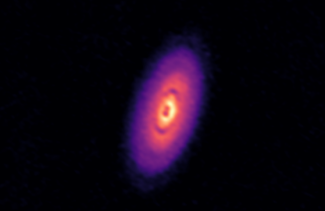 telescopes image of purple, organ and yellow disk in space