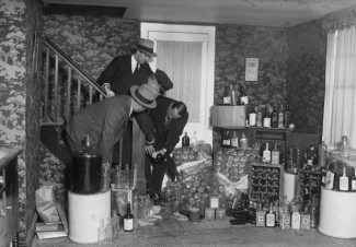 black and white archival image of alcohol hoarding