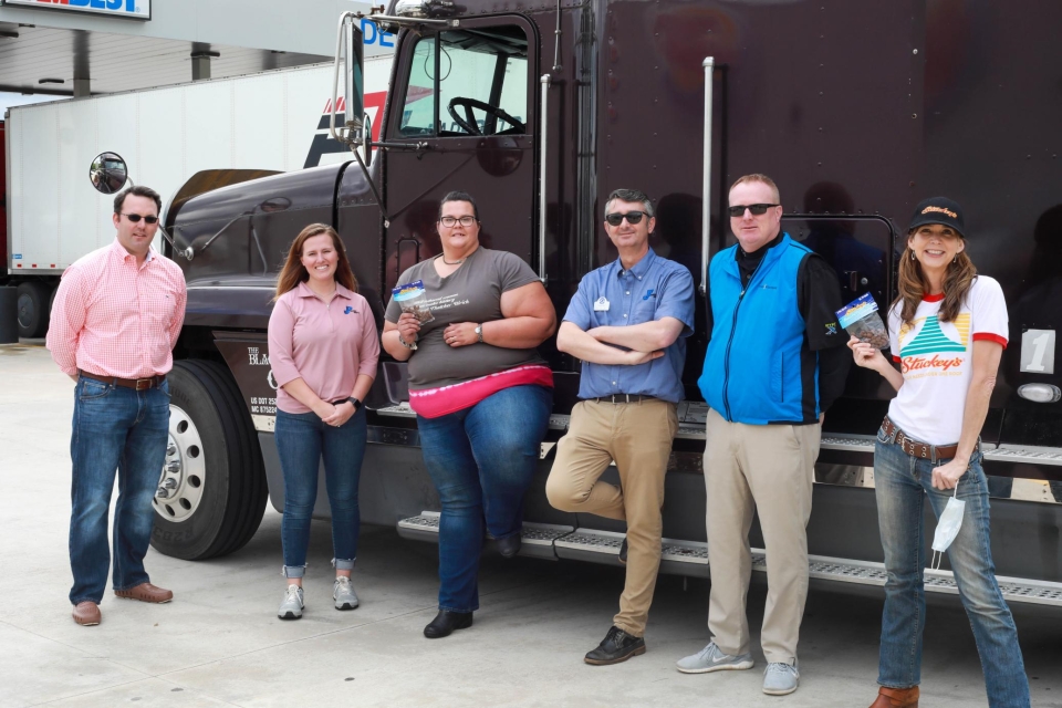 From a recent event at the JP Travel Center (Exit 205 on I-75 in Jackson, GA), the largest truck stop in Georgia, opened in November 2019 and owned by the Jones family, and State Sen. Burt Jones (pink shirt on far left), VP of Jones Petroleum and UGA alumnus.