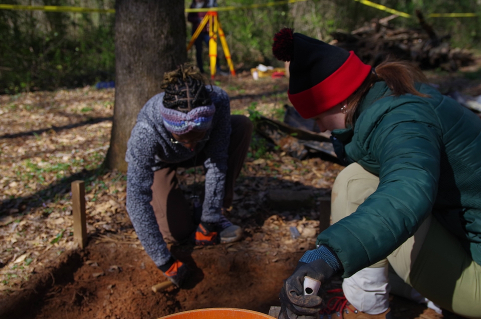 Excavation work by students Jaylin Knight and Hailey Farrar