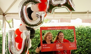 Photo of two people, with social media window