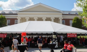 wide shot photo of event tent with people