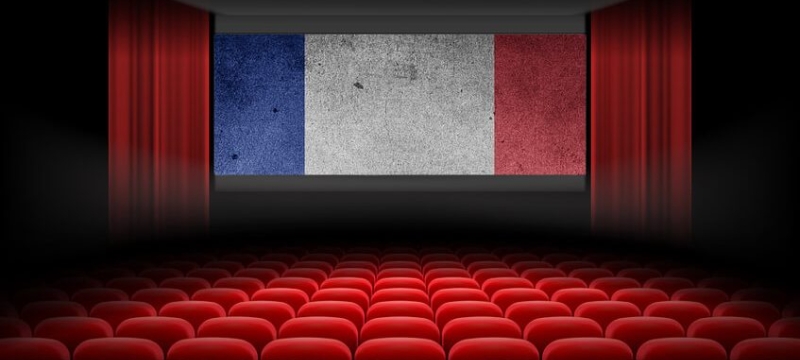 graphic of empty theater interior with French tri-color on screen