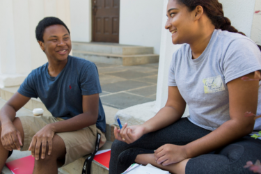 International affairs and arabic double major Jailen Gary, left, and social work and sociology major Reeya Hoosain both of Grovetown, Ga study together for an Arabic Test on the steps of the Chapel on a fall day.