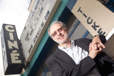 photo of man, marquee in background