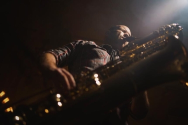 photo of saxophonist from below 