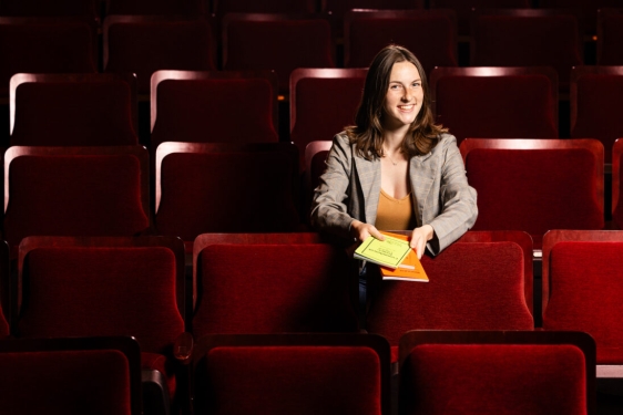 photo of woman in theatre seats