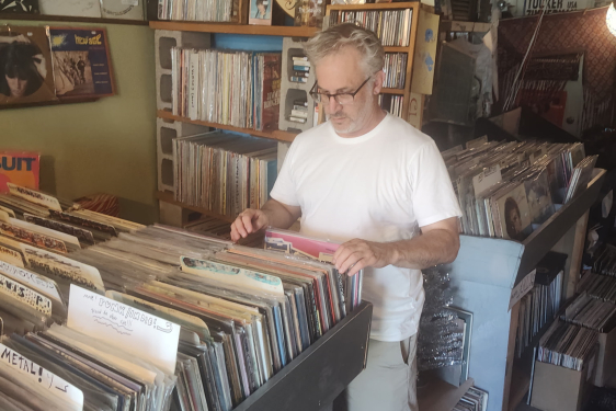 Aaron Meskin looking at records