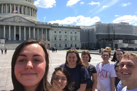 photo of eight students with US capitol building