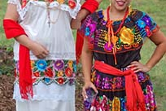 dancers in traditional Aztec costume