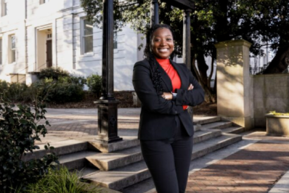 photo of woman, day, arch in background