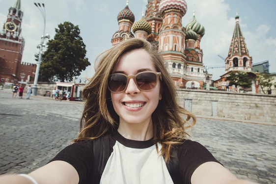 selfie photo of woman with orthodox cathedral in background