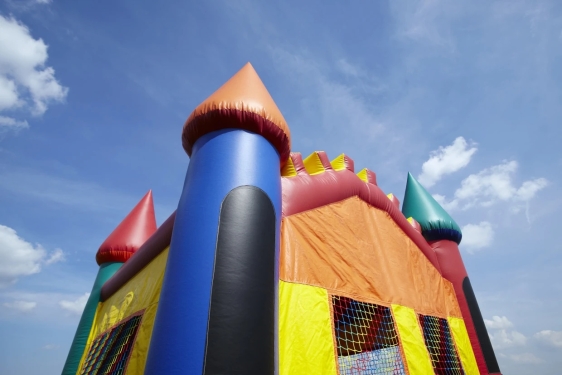 photo of bouncy castle, with blue sky