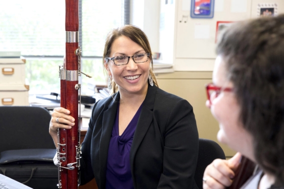 photo of woman with bassoon, and student