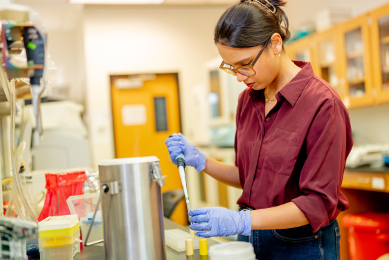 image of woman working in therapeutics lab