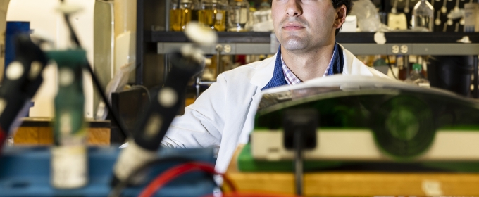 photo of man, with lab instruments in foreground
