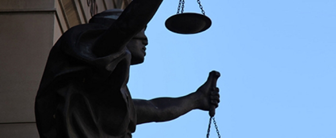 photo of statue representing blind justice
