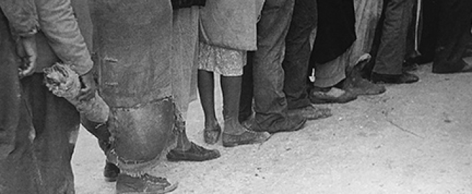 black and white photo of people standing in line