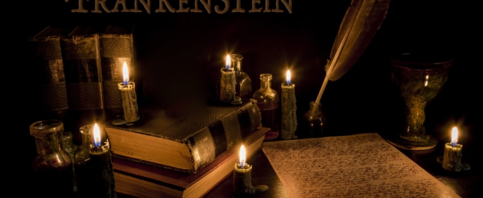 graphic with Frankenstein word, quill pen and paper, candles