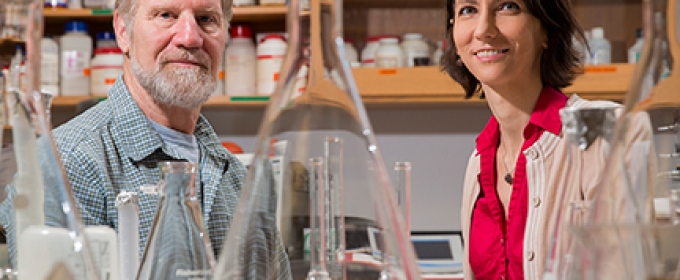 photo of man and woman in lab, with beakers