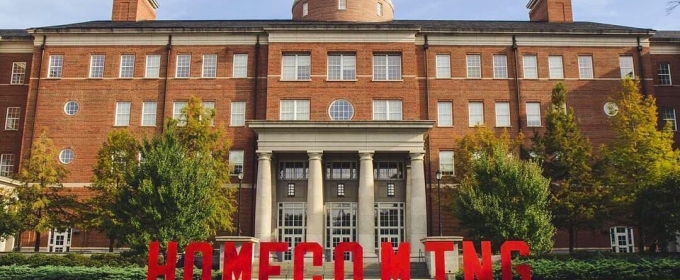 photo of building with large red letters spelling homecoming
