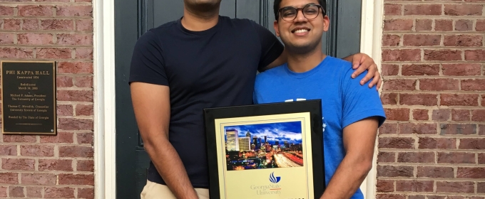 Pictured: Advait (left) and Swapnil with their 2nd place trophy.