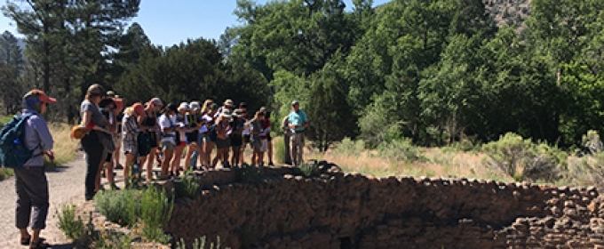 students standing near ancient burial site