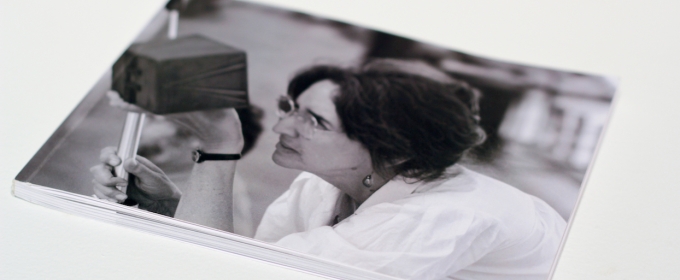 photo of a photo of woman holding pinhole camera