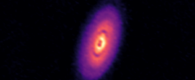 telescopes image of purple, organ and yellow disk in space