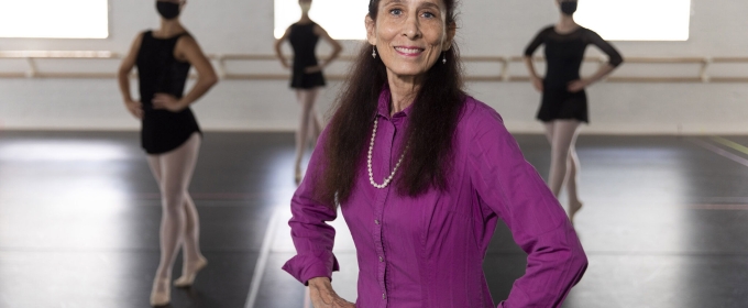 photo of woman in studio, with dancers in background