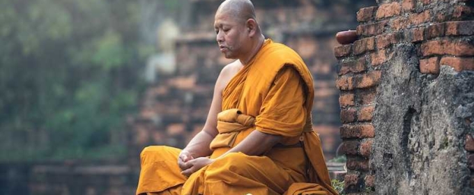 photo of a monk in meditation