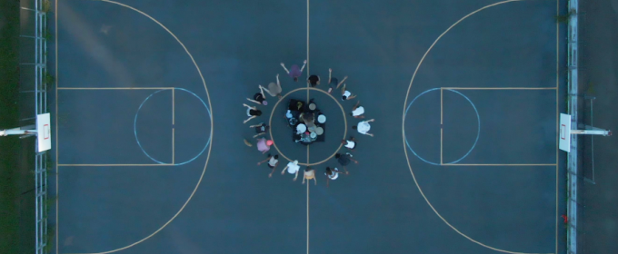 photo of basketball court with people at the center, from above